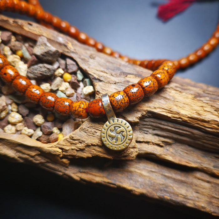 Gandhanra Old Tibetan Buddhist Mala Counter Clip for Prayer Beads,Dharmachakra / - Tibetan Buddhist mala beads, detailed view