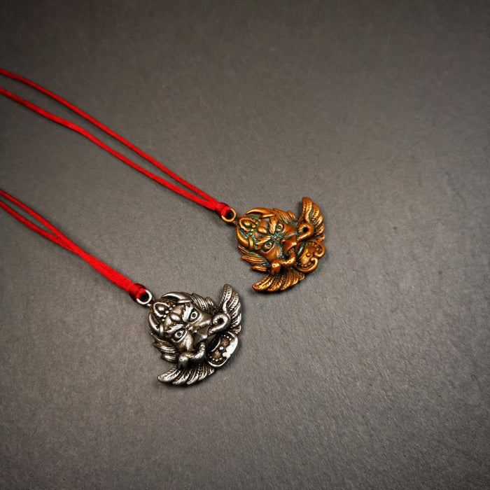 Garuda Amulet 1.37" - Tibetan Buddhist amulet, detailed view