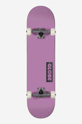 Top view of a purple Desert Dusk Goodstock complete skateboard with white wheels and silver trucks.