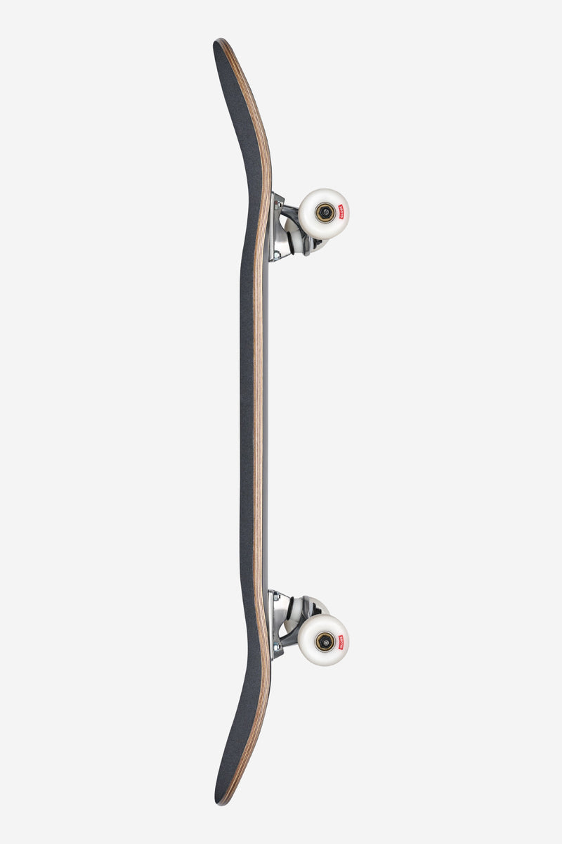Side profile of the black Goodstock deck showing silver trucks and white wheels.