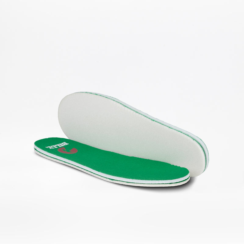 Two Green/White BILLY CS High insoles from BILLY Footwear for kids are displayed on a plain white background, with one lying flat and the other angled to show both the top and bottom surfaces.