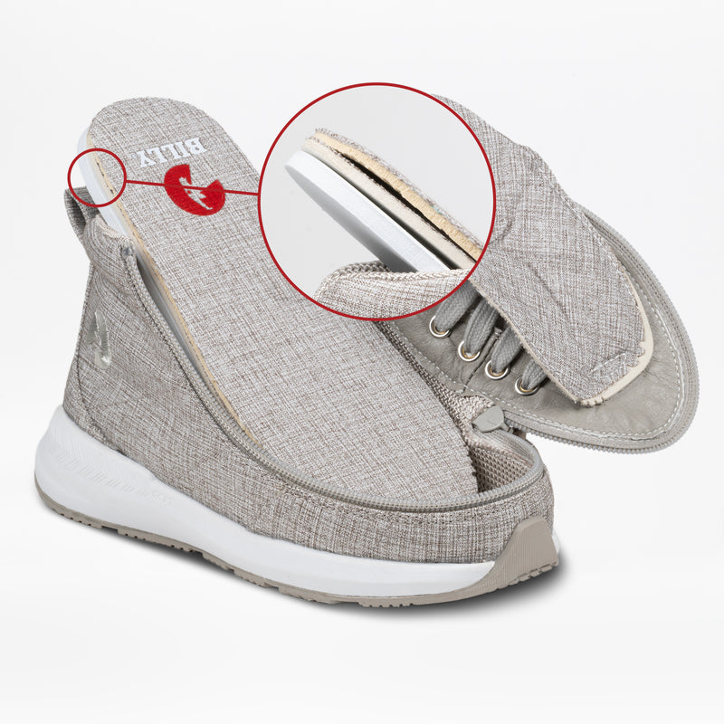 The Grey Jersey BILLY Goat Classic High by BILLY Footwear features an AFO-friendly design with a gray and white upper that unzips and lifts to reveal multiple cushioned layers, highlighting its accessibility. The insole displays the BILLY brand name.