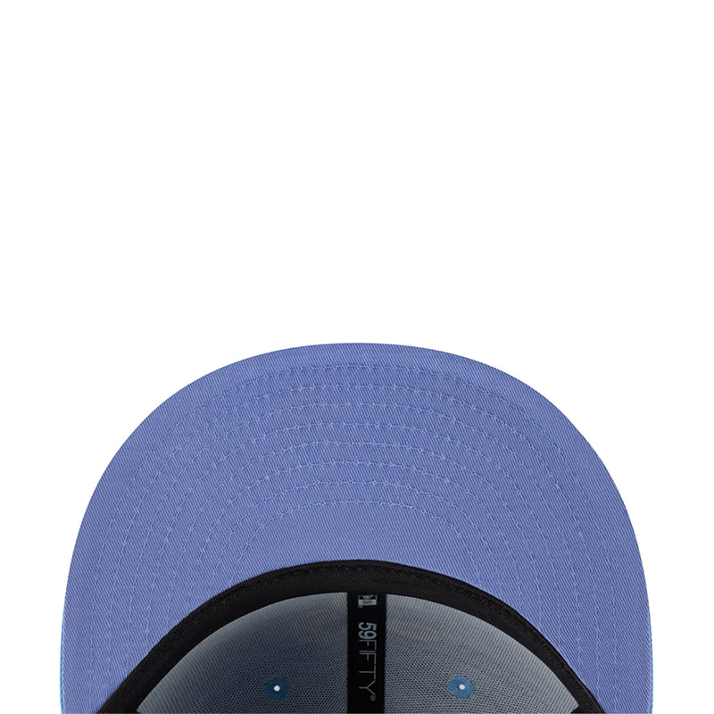 Light blue cap interior brim close-up with stitched eyelets and inner label
