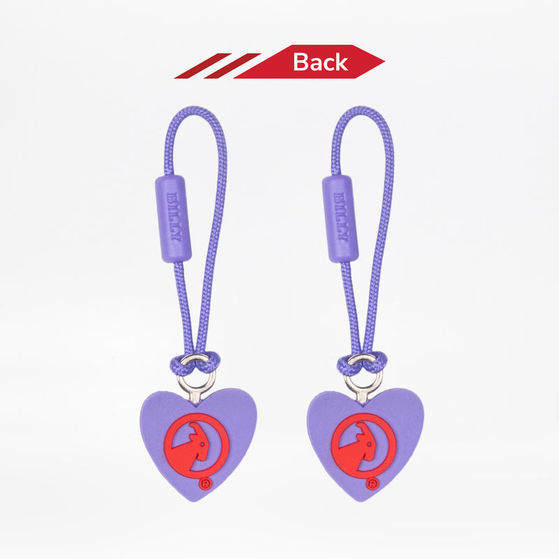 Reverse side of two heart-shaped zipper pulls with a red goat logo on a white background.
