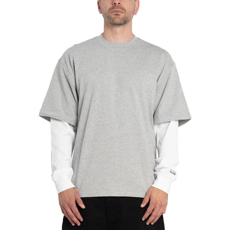 Men's heather gray crewneck T-shirt with white long sleeves peeking under hem