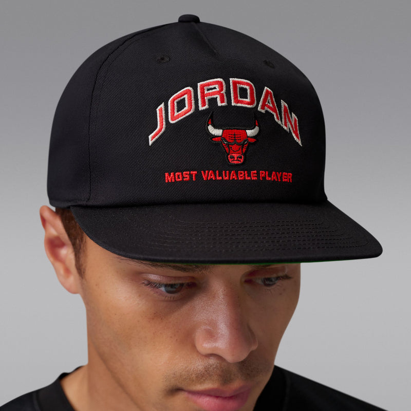 Black snapback hat with Jordan wordmark, bull icon, and red MVP slogan