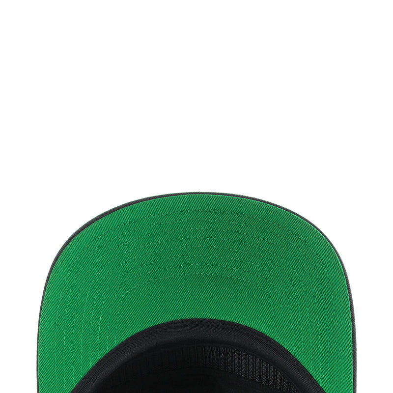 Green inner panel of a snapback cap with black brim edge
