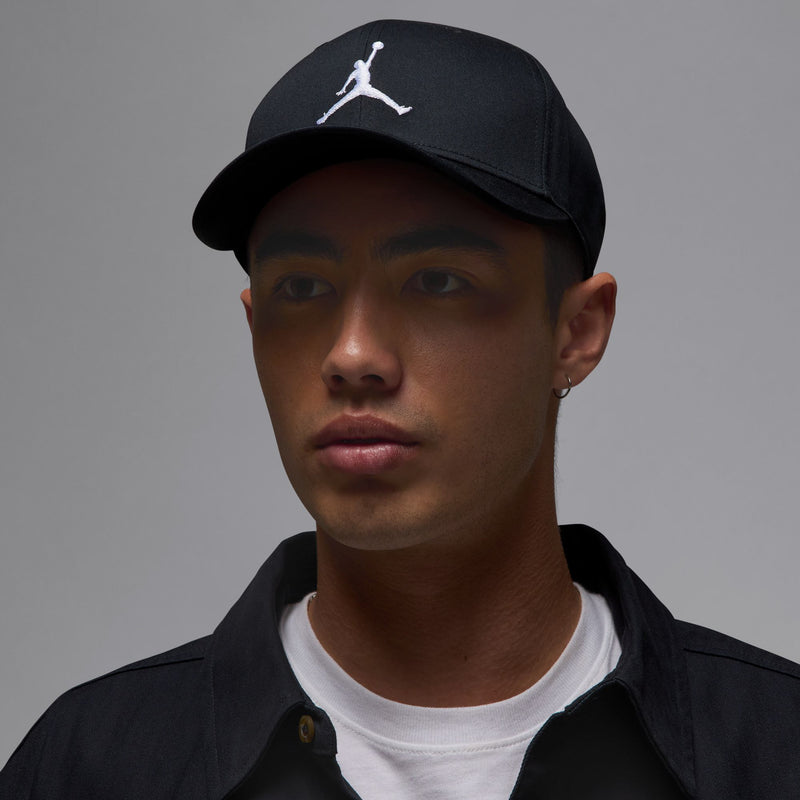 Black Jordan Rise cap on model with white Jumpman logo and curved bill