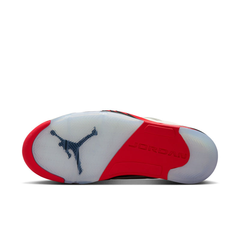 White sneaker outsole with red edge, Jordan logo, and visible tread pattern