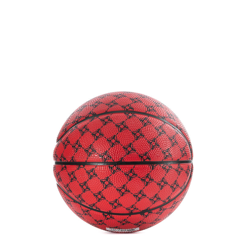 Red and black mini basketball with textured pattern and black seam