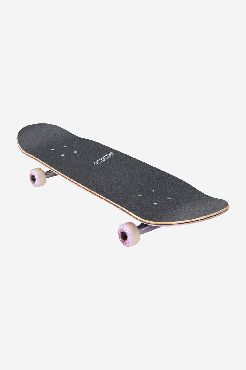 Angled top view of Peace Man Kids Wide Mid Complete skateboard showing black grip tape and pink wheels