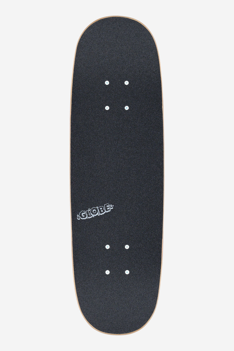 Close-up side view of the Flaming Eye Kids Wide Mini 7.9 board showing dark grip tape, silver trucks and peach wheels