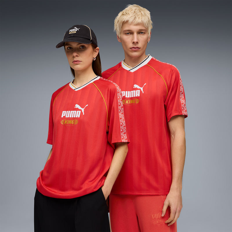 Red Puma King relaxed soccer jersey with white V-neck and yellow trim