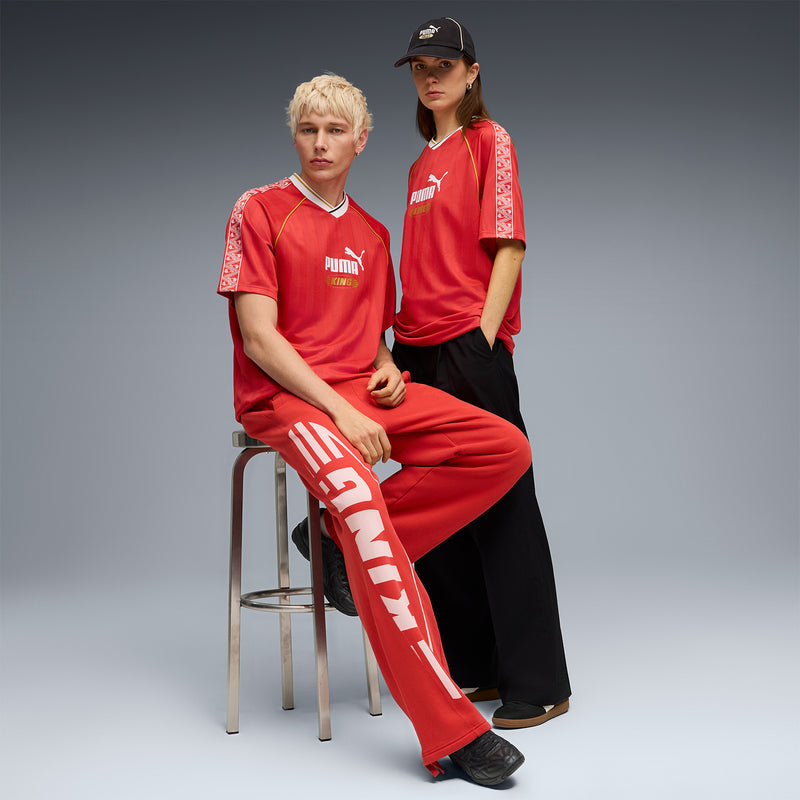 Red soccer jersey with Puma King logo, white V-neck, and patterned side panels