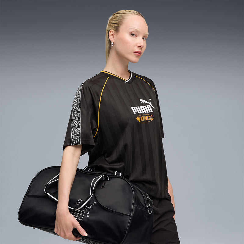 Black soccer jersey with yellow piping and Puma King logo on chest, short sleeves