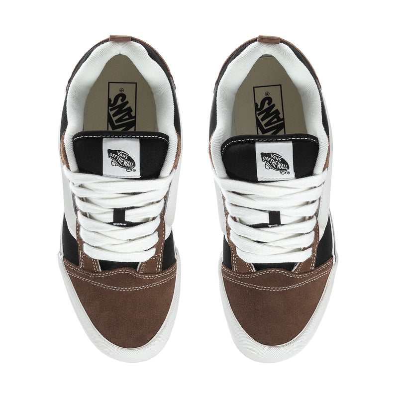 Pair of men's sneakers showing padded tongue and heel with brown, black and white