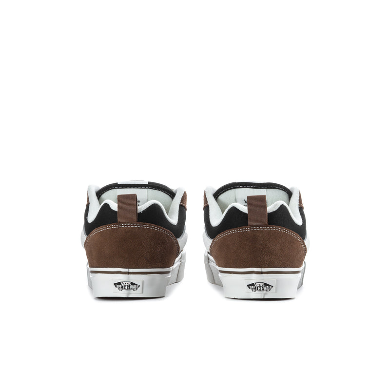 Men's sneakers heel view with brown suede backs, black accents and white rubber sole
