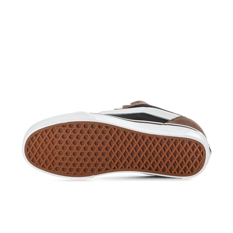 Men's sneakers outsole with brown tread and white sidewalls