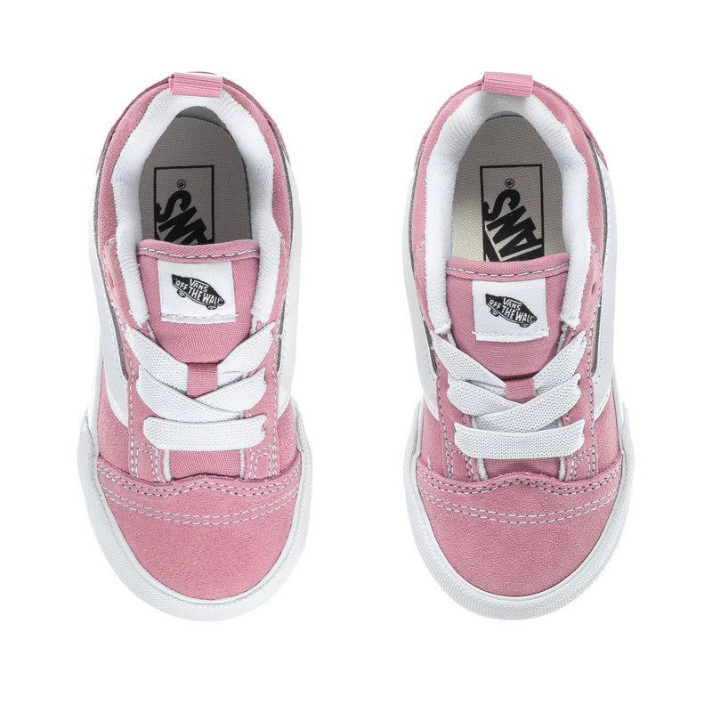 Toddler pink suede sneakers with white laces and VANS logo on tongue