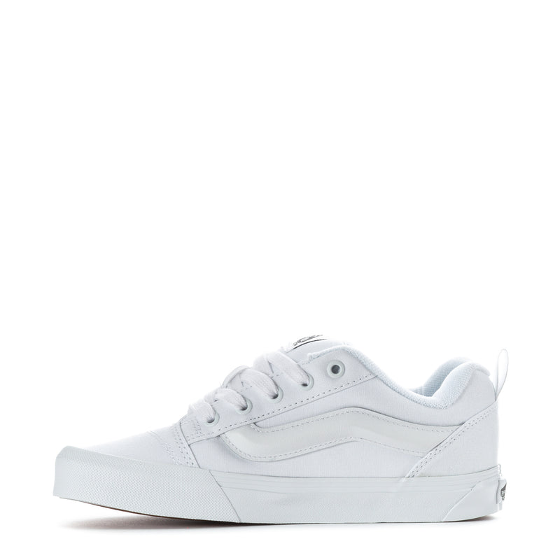 Youth white low-top sneaker, lace-up with padded collar and stitched overlays