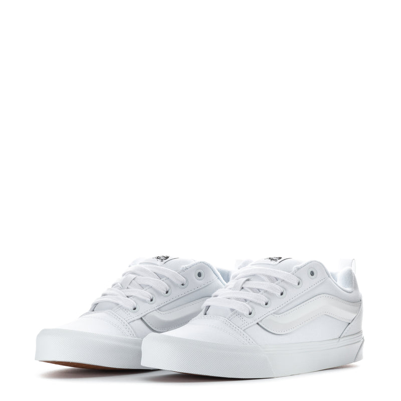 Youth white low-top sneakers with laces and stitched panels