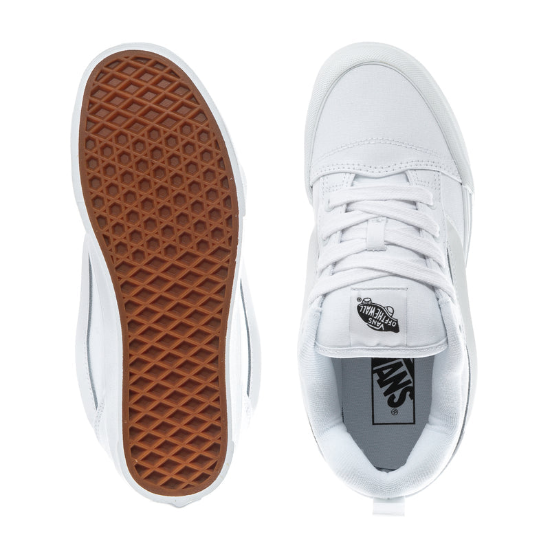 Youth white low-top sneaker with gum-brown outsole and Vans tongue patch