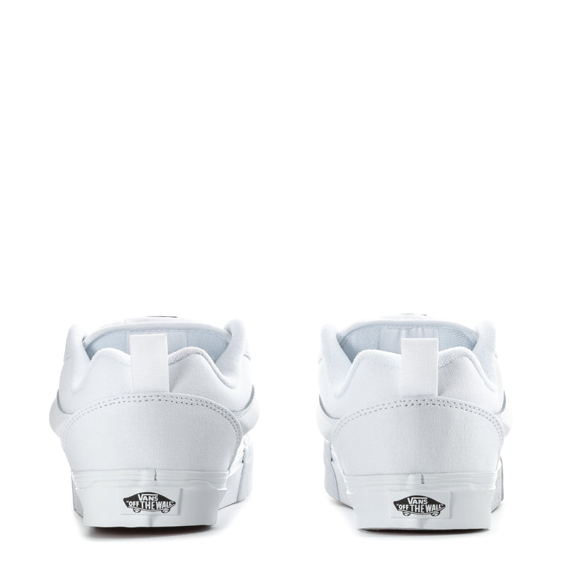 Youth white low-top sneaker with rear logo patch and cushioned heel