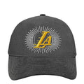 Washed black Lakers snapback cap with yellow LA skull emblem on front