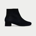 Black ankle boot on a white background