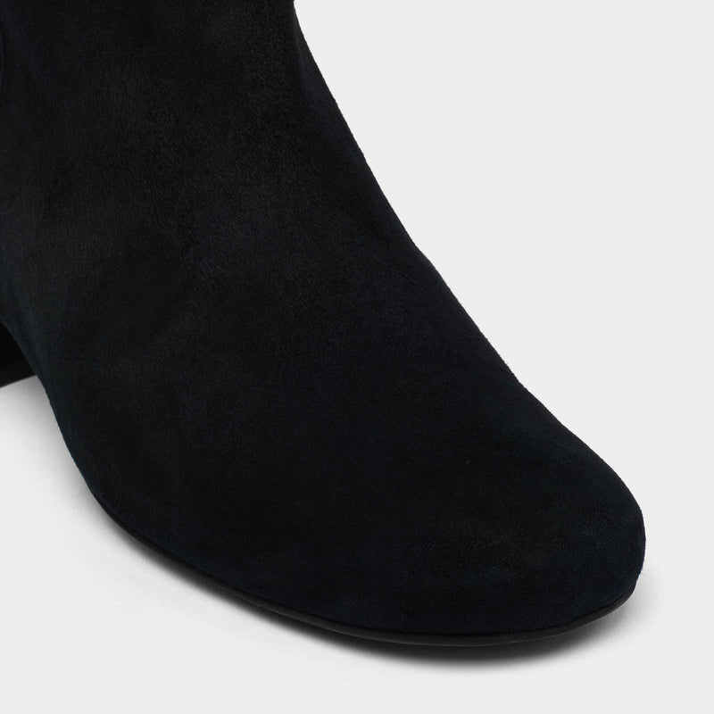 Lexie black ankle boots on a light gray background tip close-up