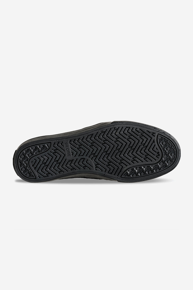Bottom view of black Liaizon skate shoe with grippy tread outsole