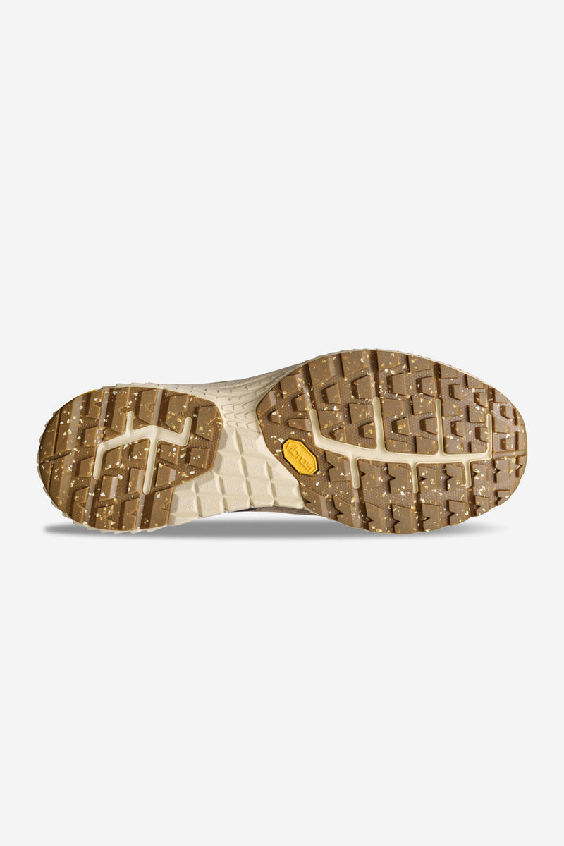 Bottom view of the Liaizon Vibram Walnut outsole with rugged tread and a yellow Vibram badge