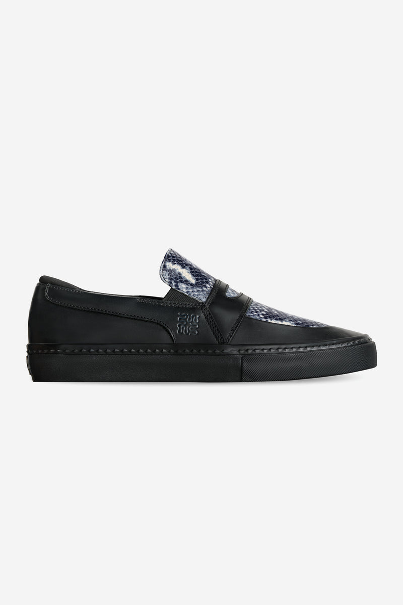 Side view of Liaizon Wasted Talent Black Snake skate loafer with black vulcanized sole and snake pattern vamp