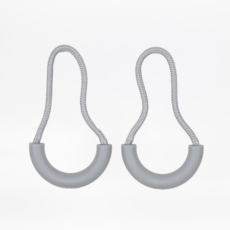 Two light grey zipper pulls with rubber half loops and light grey cord on a white background