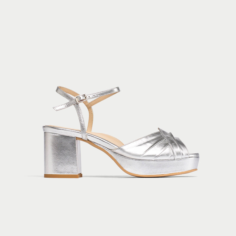 Silver platform sandal on a white background