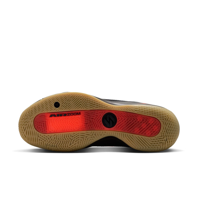 Outsole of men's basketball shoes with textured brown tread and red traction pad