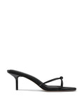Black satin Maeve Slipper by FEMME LA, side view showing low kitten heel and single knot strap across open toe