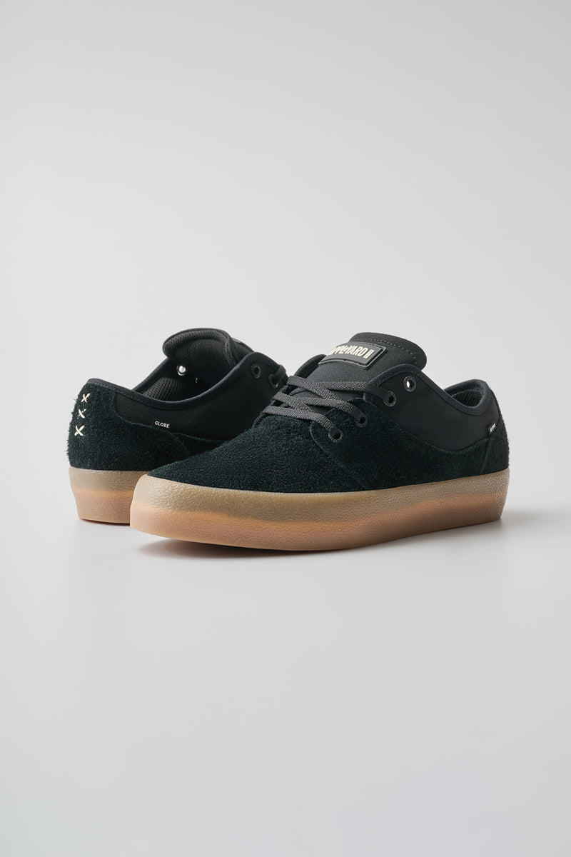 Mahalo black skate shoe with gum crepe sole shown from a low angle three quarter view