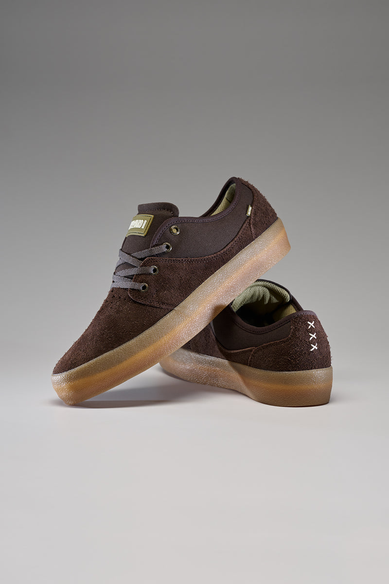 Dark brown Mahalo skate shoe with suede upper and tan gum outsole shown in side profile