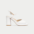 White high-heeled shoe with a block heel on a light gray background
