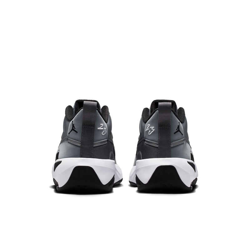 Men's high-top sneakers from heel view with black tabs and white wedge midsole