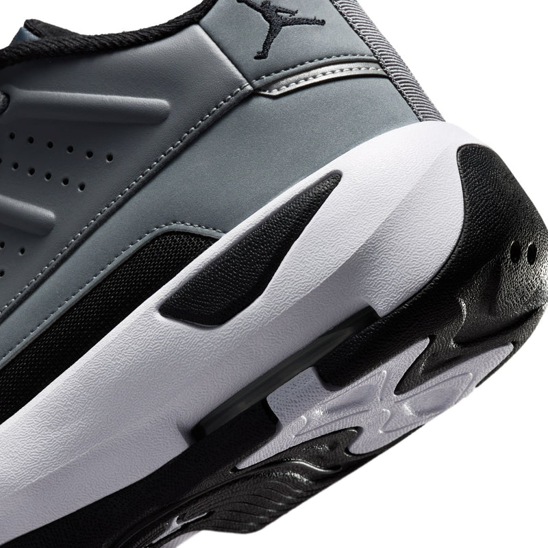Close-up of men's sneaker outsole and midsole, cool grey upper with black details