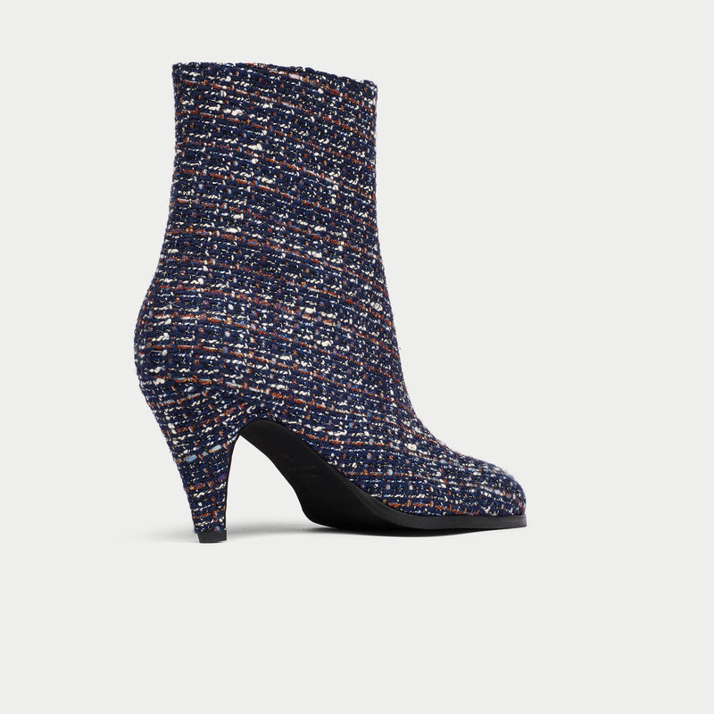 Maya Tweed ankle boot on a light gray background
