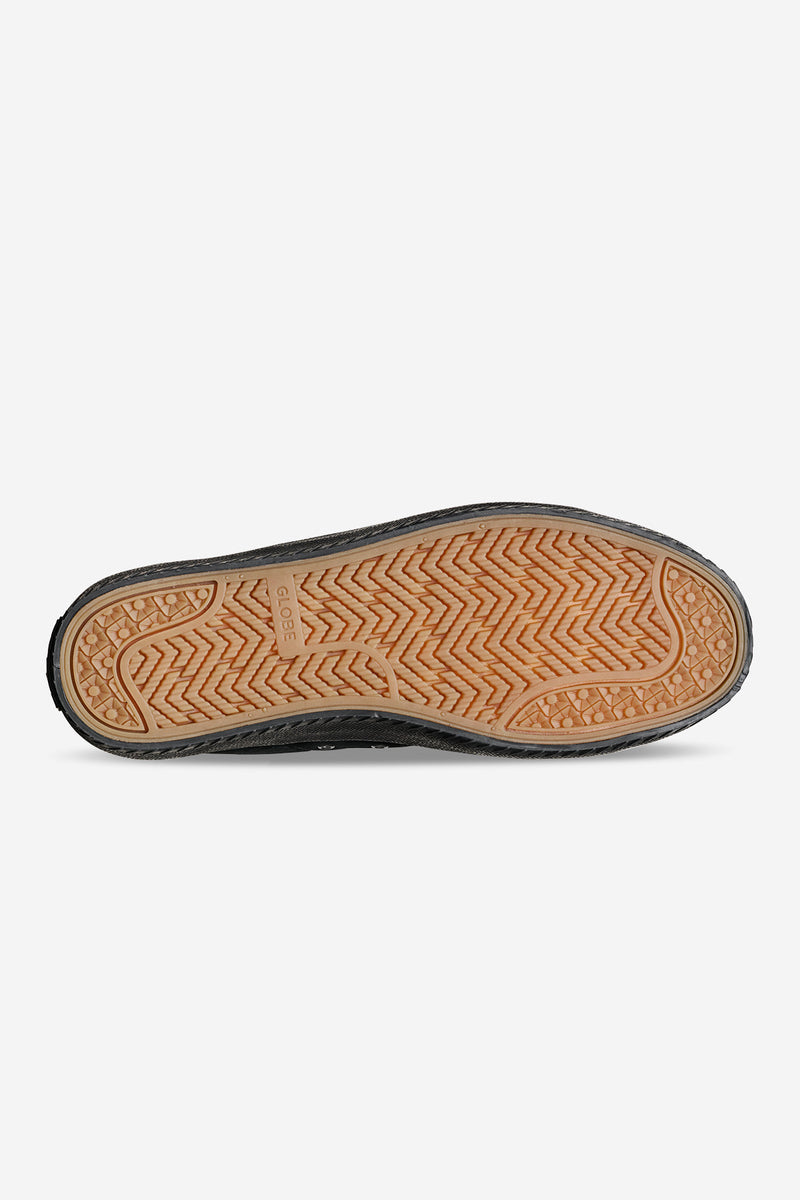 Bottom view of Melbek High black sneaker showing tan rubber outsole with a herringbone tread