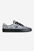 Side profile of Melbek Wasted Talent sneaker in blue snake print suede upper and black sole