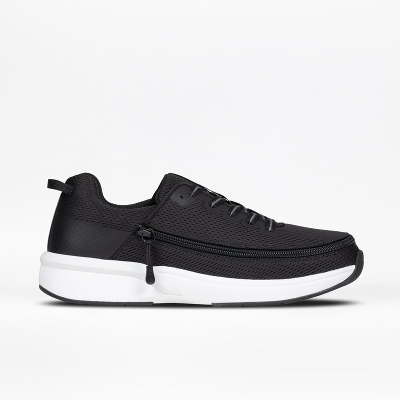 The Men's Black BILLY Limitless by BILLY Footwear features a mesh upper, black laces, thick white sole, and visible side zipper for easy on/off. Displayed in profile against a white background.