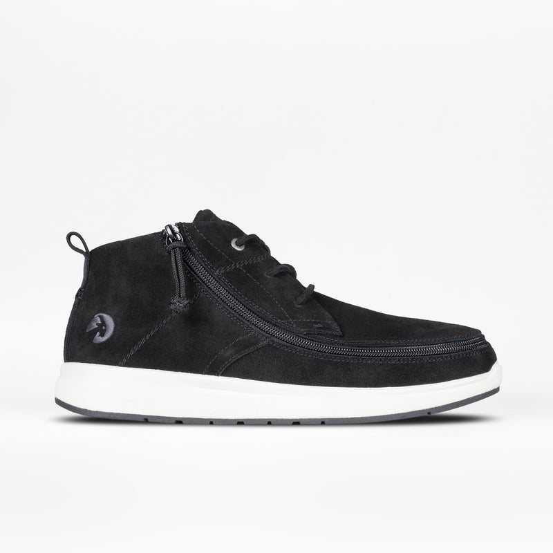 The Men's Black Suede BILLY Comfort Chukka by BILLY Footwear features a white sole, wraparound side zipper, and laces. Shown in profile on a plain white background; part of the Comfort Chukkas collection for men.