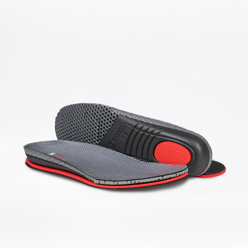 The Men's Charcoal BILLY Limitless insoles by BILLY Footwear are displayed, with one flat and the other upright to reveal the textured black underside and cushioned red heel area.