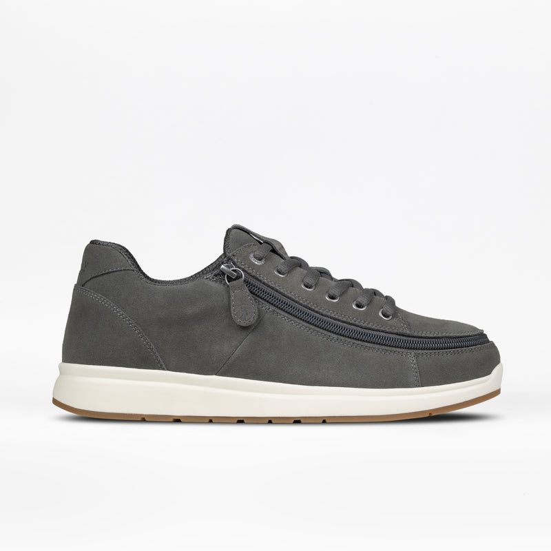 The Men's Charcoal Suede BILLY Comfort Plush by BILLY Footwear features a white sole, gray laces, and a side wraparound zipper, shown on a plain white background.