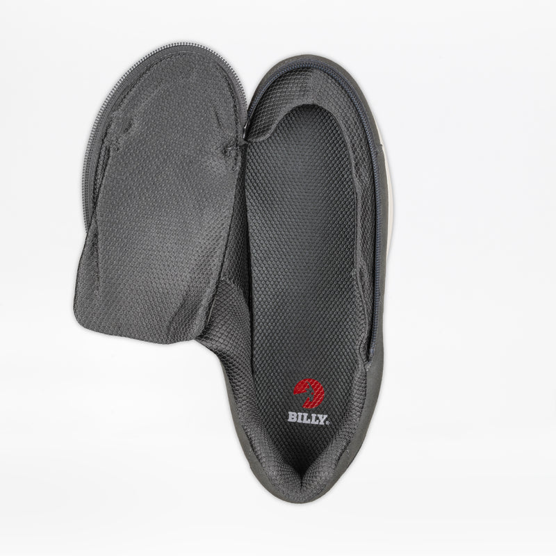 A single Men's Charcoal Suede BILLY Comfort Plush shoe by BILLY Footwear features a wraparound zipper that lets the upper open fully, revealing the inner sole and red BILLY logo.